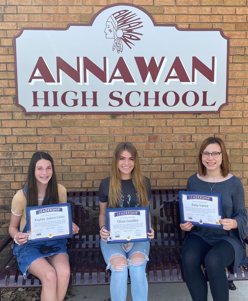 Kaylee Celus, Olivia Goodley, and Zoey Vance seated holding certificates